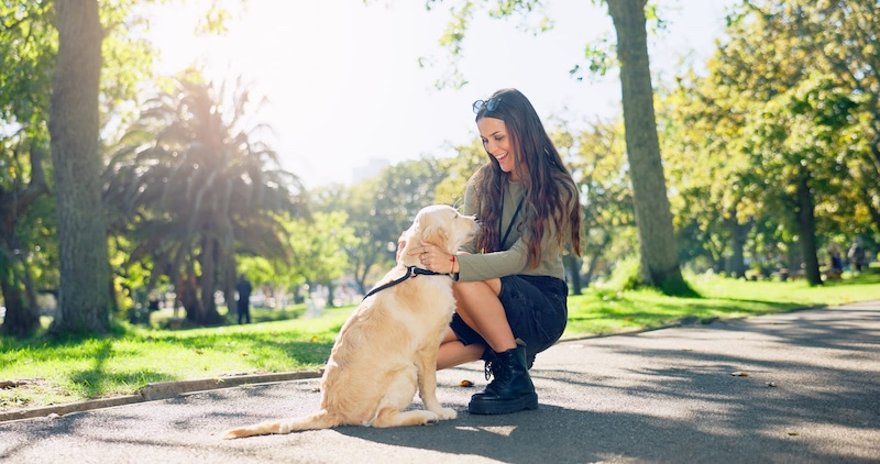 woman with dog at park
