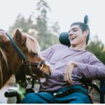 Man in wheelchair for hippotherapy session