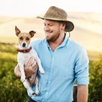 man holding dog