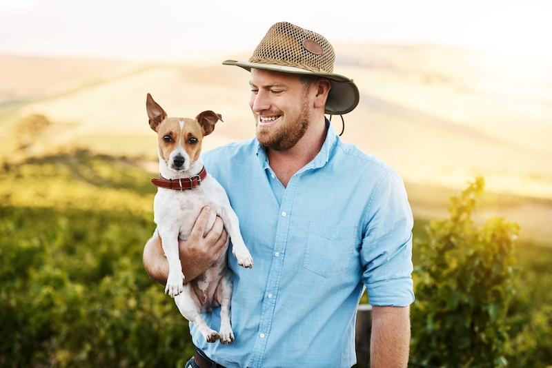 man holding dog