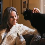 woman bonding with cat