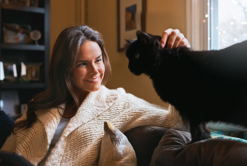 woman bonding with cat