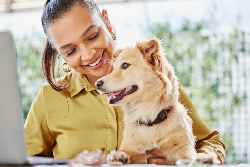woman with tan dog